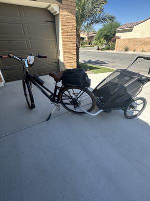 Pedego e-bike, cup holder, lock, convertible bag, phone holder, chariot attachment.