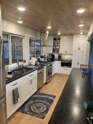 Kitchen flooring also used on ceiling.