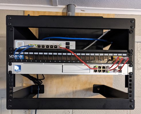 Small rack setup with enterprise networking hardware for a NJ non-profit organization.