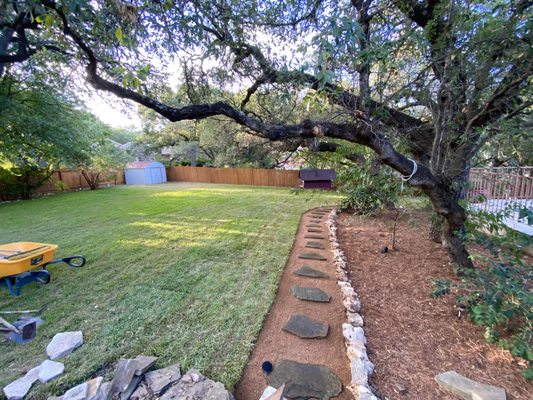 St. Augustine sod with a flagstone and crushed granite walkway