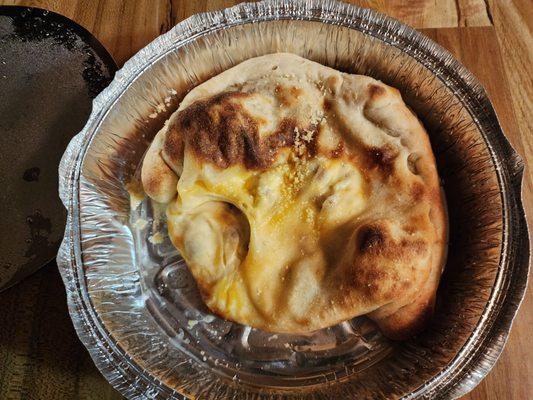 It's supposed to be a Calzone,  it's more like a "Hot MESS". Their cook needs to be Fired!