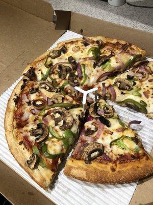 Original pan pizza with green peppers, mushroom, and onion. Cooked to perfection!