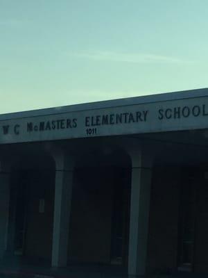 The school's name on the front of the building.