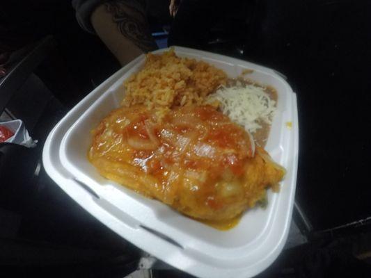 chili rellenos  is a deep fired chili pepper stuffed with cheese with a side of beans in rice.