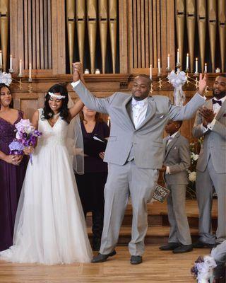 Celebrating being pronounced husband and wife - by Holmes Photography Studio.