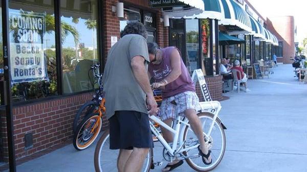 Mark showing John the Pedego City Commuter.