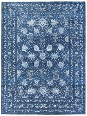 Hand knotted blue and white wool and silk rug.