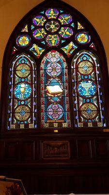 The altar window depicting the sacraments of Lutheran worship.