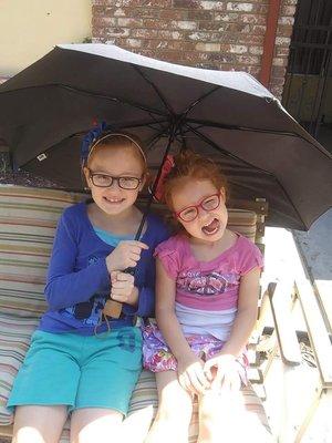 Both my girls sporting glasses from Dr James Stewart's office.