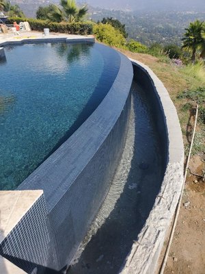 Infinity with black glass tile.