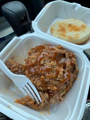 Under the hood of this pulled pork sandwich...a little added sauce, which I could drink on its own.