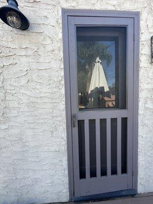 The new, improved, re-screened and handsome door!