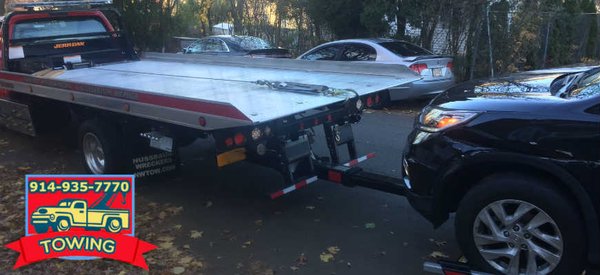 towing and recovery by flatbed tow truck in Harrison NY and Rye, Mamaroneck, and Port Chester