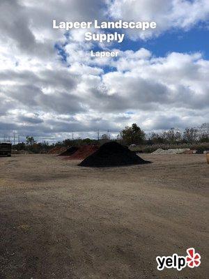 The extra piles of landscaping materials.