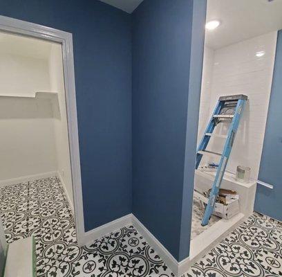 Bathroom and closet remodel with unique Spanish tile and a pop of color to brighten any room!