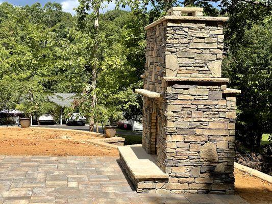 Custom built stone outdoor fireplace