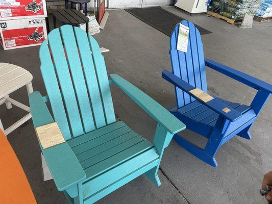 Aruba and Blue chairs side by side, same chair, both with $309 price tags that had that price for so long the price tag was fading,