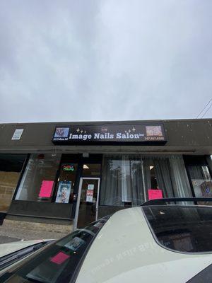 Wider shot of the salon and there phone number to book an appointment