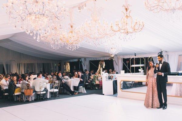 Under the tent decorated for a magical wedding reception.