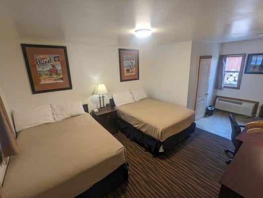 Room with 2 double beds and air conditioning