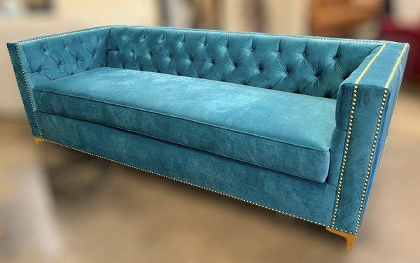 Geneva tufted sofa with gold nailheads and gold legs