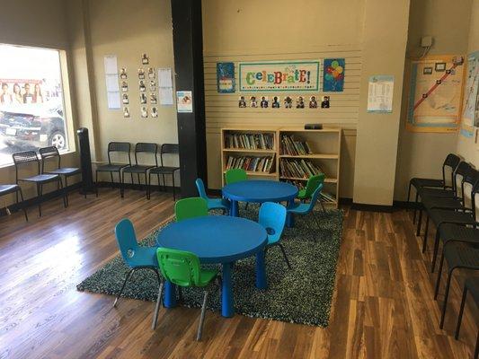 Waiting area for parents and children with Kumon Library and Award Wall