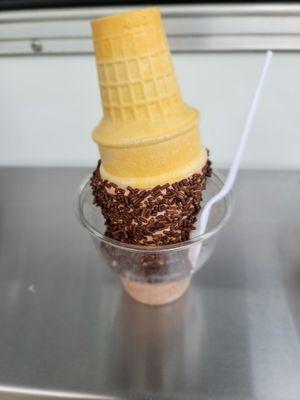 Medium soft chocolate with chocolate sprinkles, cone in a cup