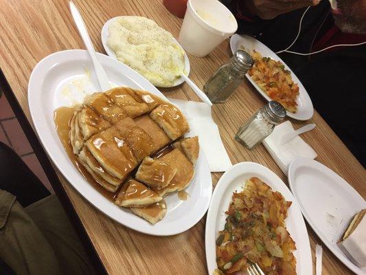 Pancakes, grits, and home fries.