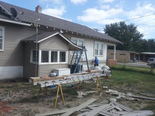 Vinyl Siding ('Khaki' -- In Stock) and Roofing Materials ('Weathered Wood' -- Castebrook 35 yr Shingle -- In Stock).