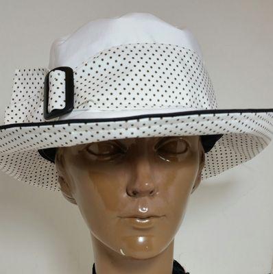 White Dot, there is also a black dot.  We have about sixteen colors and combinations in the Rain & Shine hats