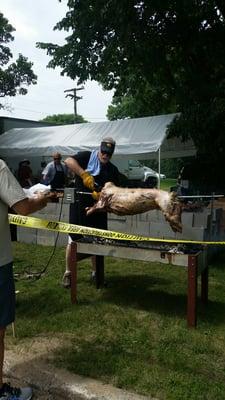 Roasting a lamb.