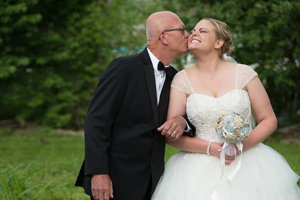 Bride and daddy in an adorable moment.