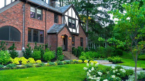 Front lawn with tree, shrub and perennial planting.