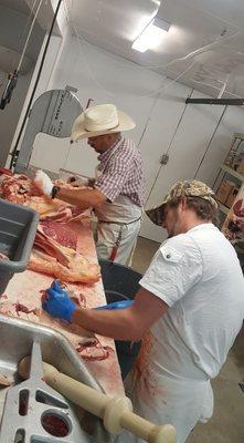 Owner (Brian) and his assistant (Austin) working on processing a beef cow.