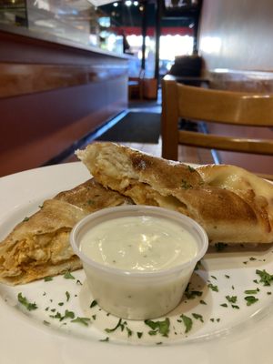 Buffalo chicken roll served with bleu cheese