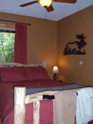 Snooze in a charming log bed with down comforters at Ski Town Condos in Monarch.