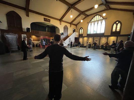 Practicing Hunyuan gong, a form of qigong, at the Taoist Studies Institute