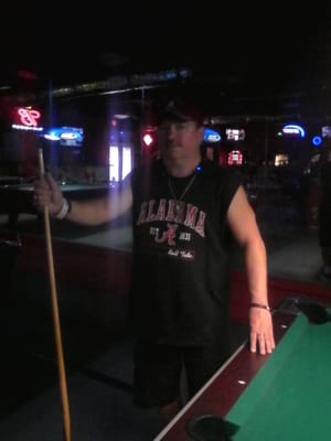 Bobby trying to playing pool