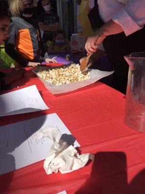 Halloween Party making Carmel popcorn