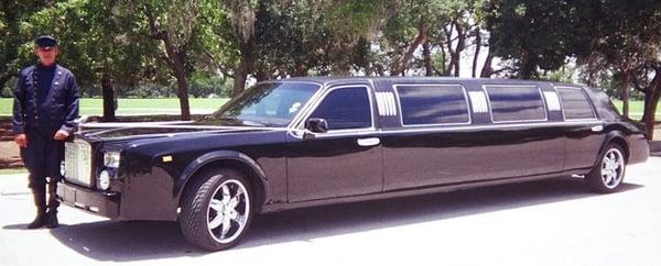 Our wedding Limo with ribbons and your driver dressed in full Rolls Royce attire.