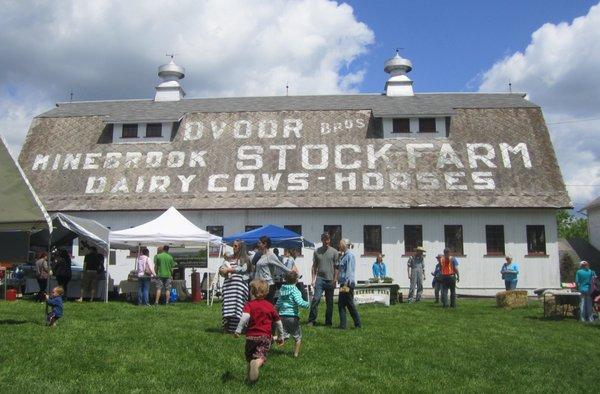 The iconic Dvoor Bros. logo painted on the roof of the horse barn provides a perfect backdrop to the market.