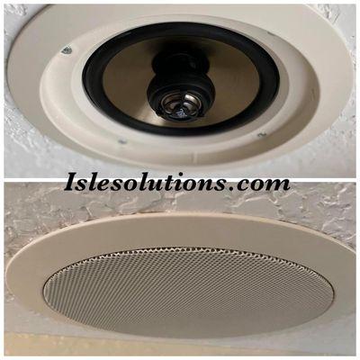 In ceiling speakers. Get rid of the cluttering.