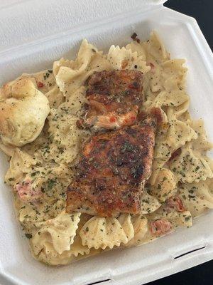 Shrimp bow tie pasta topped with a sweet chilli glaze salmon