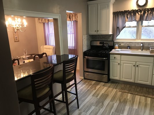 New granite bar eliminated the traditional kitchen table for a more open space