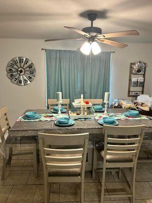 A dining room that now a family can have a family dinner at.