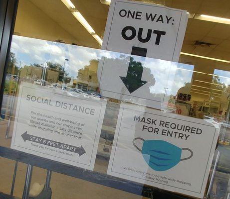 Social distancing protocol clearly posted on the entrance and exit. Tuesday Morning, Valrico FL