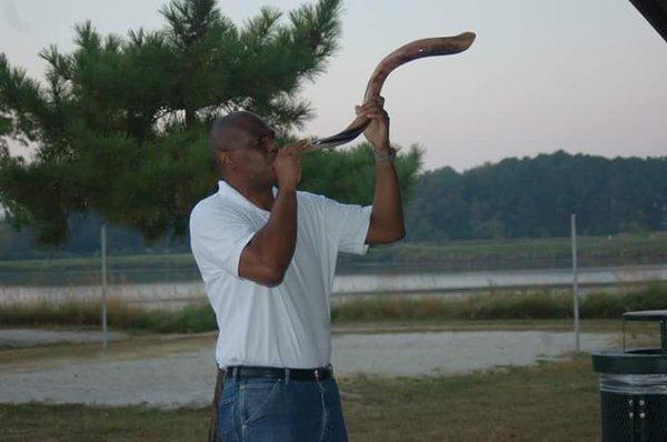 Our awesome Pastor demonstrating the shofar.