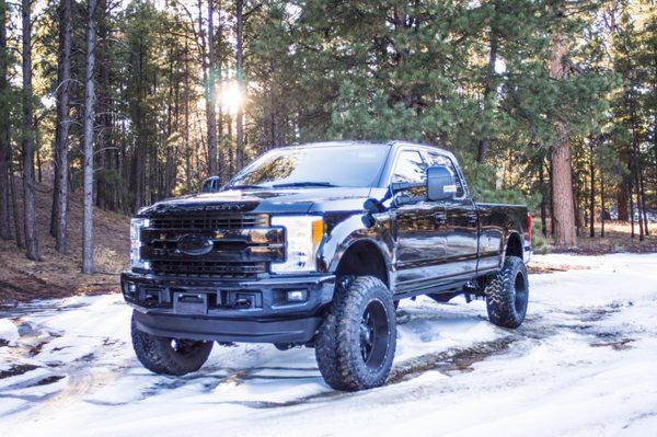 Completely blacked out 2018 Ford F350. We painted the bumpers, grille, and emblems to give this truck a clean, seamless look.