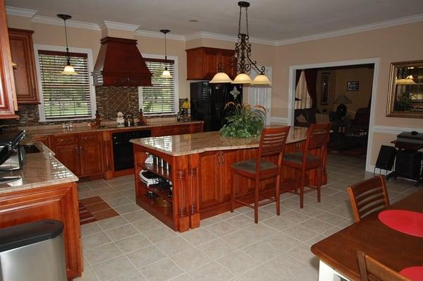 Glazed cherry cabinets with reclaimed/upgraded hood