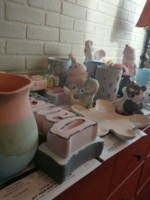 Pottery waiting to be glazed and fired in the kiln.